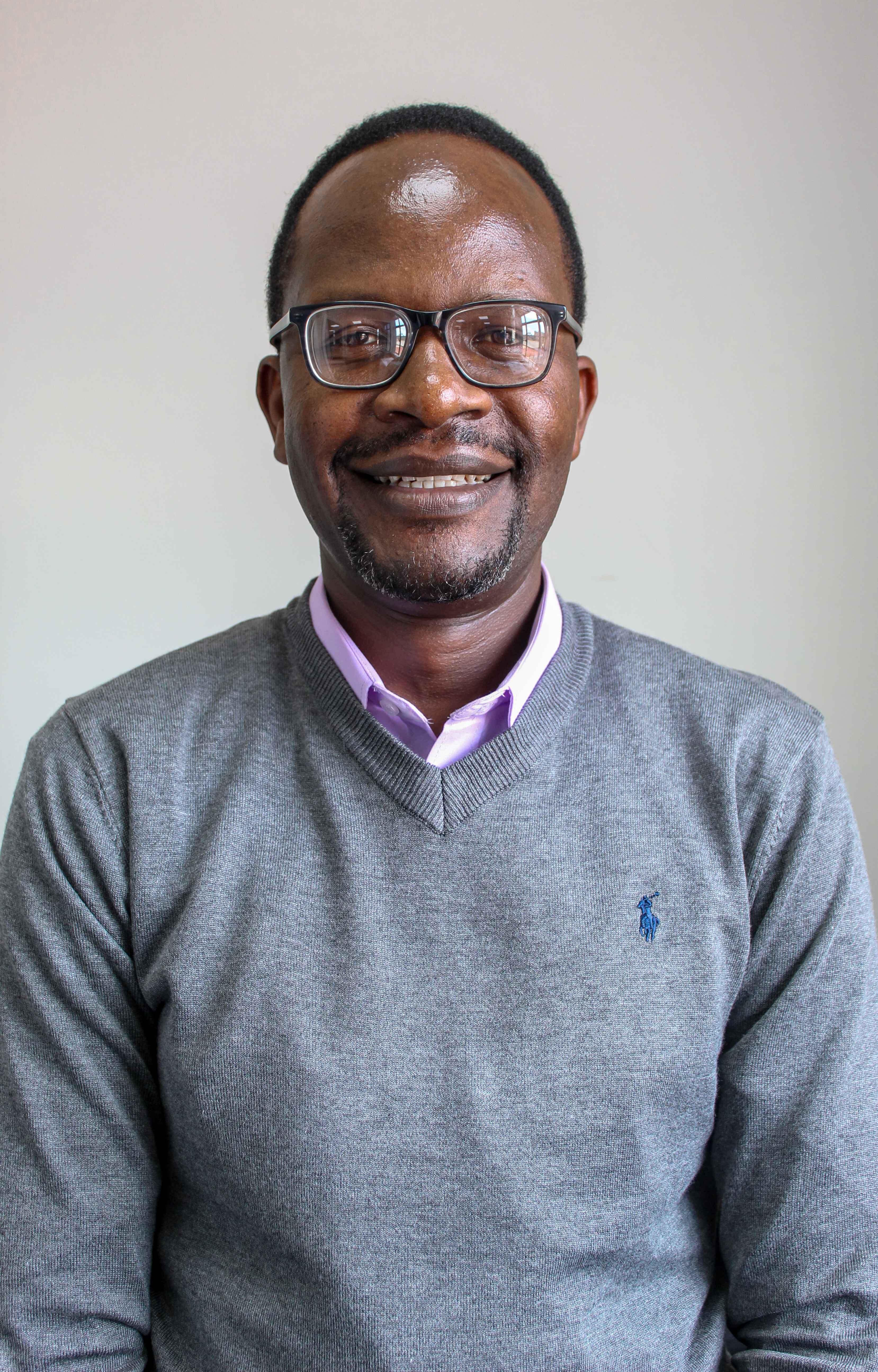 Professional photo of Dr. George Paul Omondi, Senior Research Fellow at CEMA
