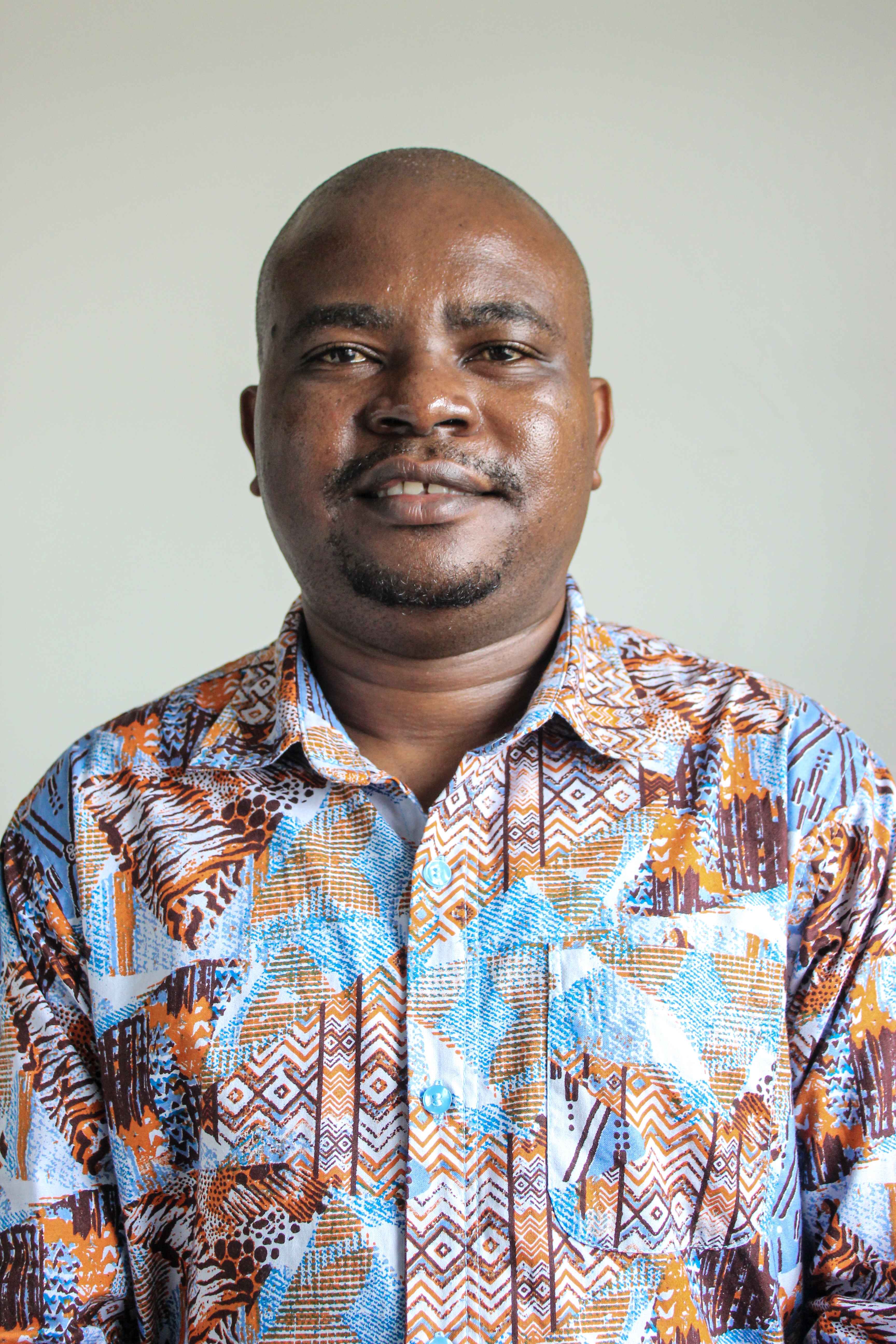 Professional photo of Dr. Muema Mulei, Post Doctoral Fellow at CEMA